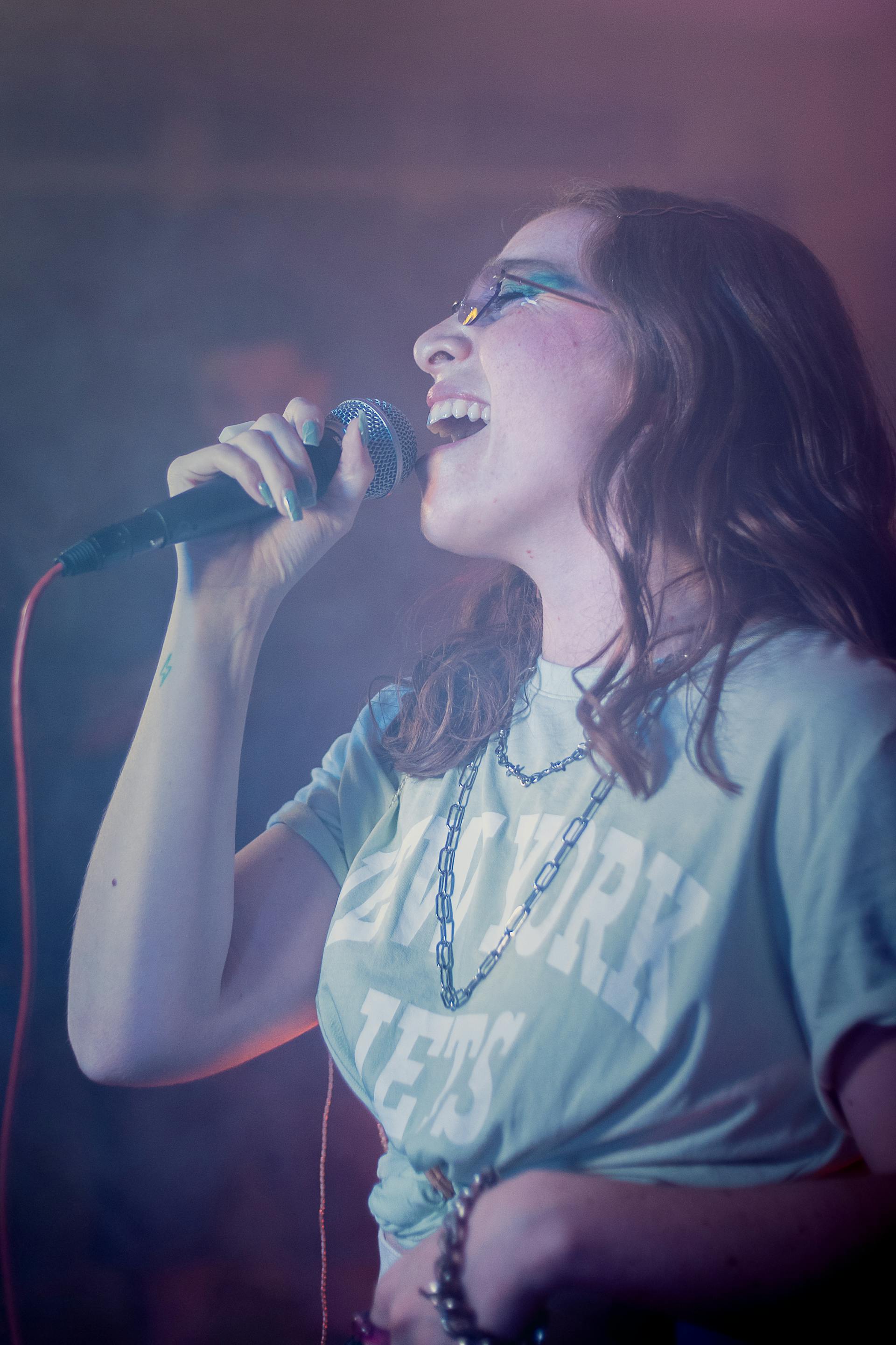 Singer performing during a voice lesson performance coaching session